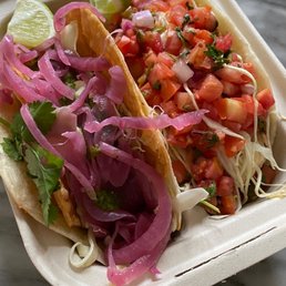 Soft and crunchy carnitas taco + fish taco Soft and crunchy carnitas taco + fish taco