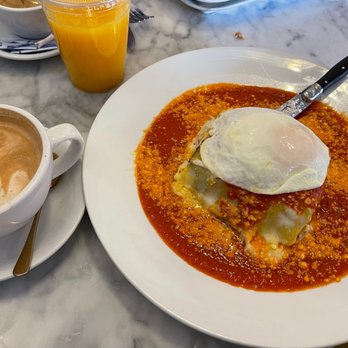 Immigrant Son Caffe - Dirty Chai, fresh OJ & Breakfast Lasagna with a fried egg on top. - New American Near Me - Ventura, California Immigrant Son Caffe - Dirty Chai, fresh OJ & Breakfast Lasagna with a fried egg on top. - New American Near Me - Ventura, California