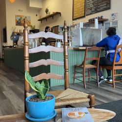 Colibri Coffee - The restaurant inside. Small but so cute clean aesthetic and Hispanic art decor and greenery.