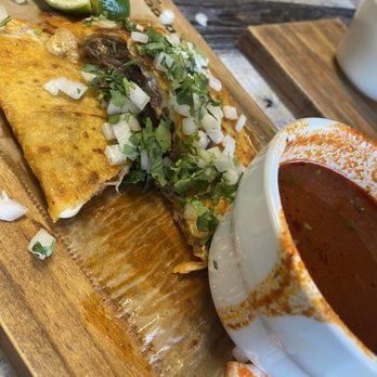 Tacos Madre - Stopped halfway to get a photo of this delicious quesabirria. - Mexican Near Me - Costa Mesa, California Tacos Madre - Stopped halfway to get a photo of this delicious quesabirria. - Mexican Near Me - Costa Mesa, California