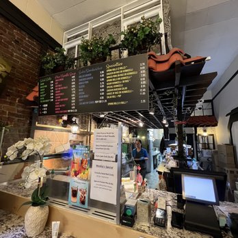 Pholicious - a restaurant counter with a menu on it - Vietnamese Near Me - Vancouver, British Columbia