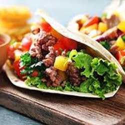 Hindle's Catering - The Fajita and Taco Salad Bar is served with rice, beans and all the fixings to make it a complete meal and perfect for lunch or dinner