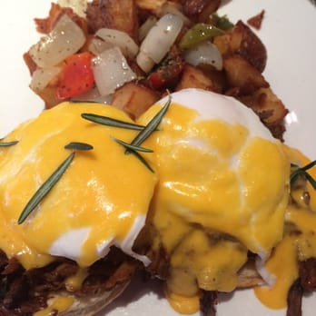 Ovelia - Special: Eggs over BBQ pork rib and a fresh buttermilk biscuit with hollandaise sauce and red potato home fries. - Greek Near Me - Astoria, New York Ovelia - Special: Eggs over BBQ pork rib and a fresh buttermilk biscuit with hollandaise sauce and red potato home fries. - Greek Near Me - Astoria, New York