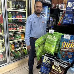 a man standing in a grocery store a man standing in a grocery store