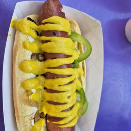 Tasty dog with onions, cream cheese, and jalapeños.
