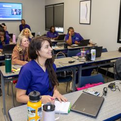 Northwest Career College - Northwest Career College students engaged in a classroom healthcare lecture session with laptops and study materials