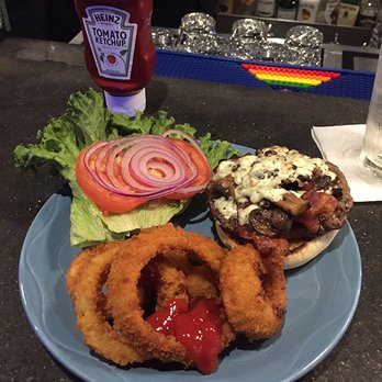 Spencer's Corner Bar - A build-your-own burger accompanied by terrific onion rings. - Bars Near Me - Wilton Manors, Florida Spencer's Corner Bar - A build-your-own burger accompanied by terrific onion rings. - Bars Near Me - Wilton Manors, Florida