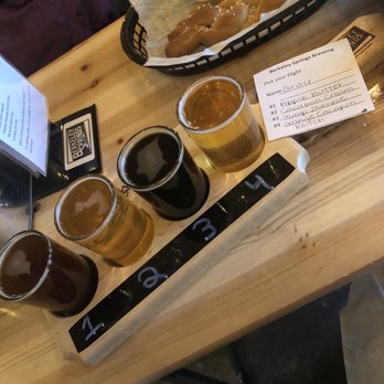Berkeley Springs Brewing - Apple Butter, Coolfont Cream, Stump Stumble Stout, and Orange Cacapon Kolsch. Pretzel in the background! - Barbeque Near Me - Berkeley Springs, West Virginia Berkeley Springs Brewing - Apple Butter, Coolfont Cream, Stump Stumble Stout, and Orange Cacapon Kolsch. Pretzel in the background! - Barbeque Near Me - Berkeley Springs, West Virginia