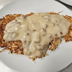 Copper Cove Restaurant - Side order of hashbrowns with country gravy on top