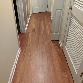 Eco Value Flooring - a hardwood floor in a hallway - Flooring Near Me