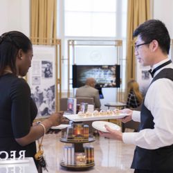 Scientology Information Center - Guest being served hors d'oeuvres at the Human Rights Anti-Bullying Month Awareness event at the Scientology Information Center (Oct 2015)