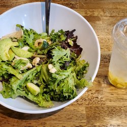The Chopped Leaf - Sunshine salad modified with no gluten or cheese, with grilled-chicken added. Along with a pineapple, lemon water.