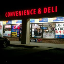One Stop Convenience & Deli - Storefront at night