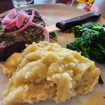 Mickey's Irish Pub - Pub steak with chimichurri with brocolini and mashed potatoes - Irish Pub Near Me - Fullerton, California Mickey's Irish Pub - Pub steak with chimichurri with brocolini and mashed potatoes - Irish Pub Near Me - Fullerton, California