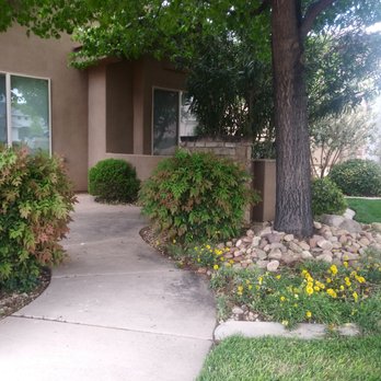St George Lawn Care - a house with a tree in the front yard - Lawn Services Near Me - St George, Utah St George Lawn Care - a house with a tree in the front yard - Lawn Services Near Me - St George, Utah