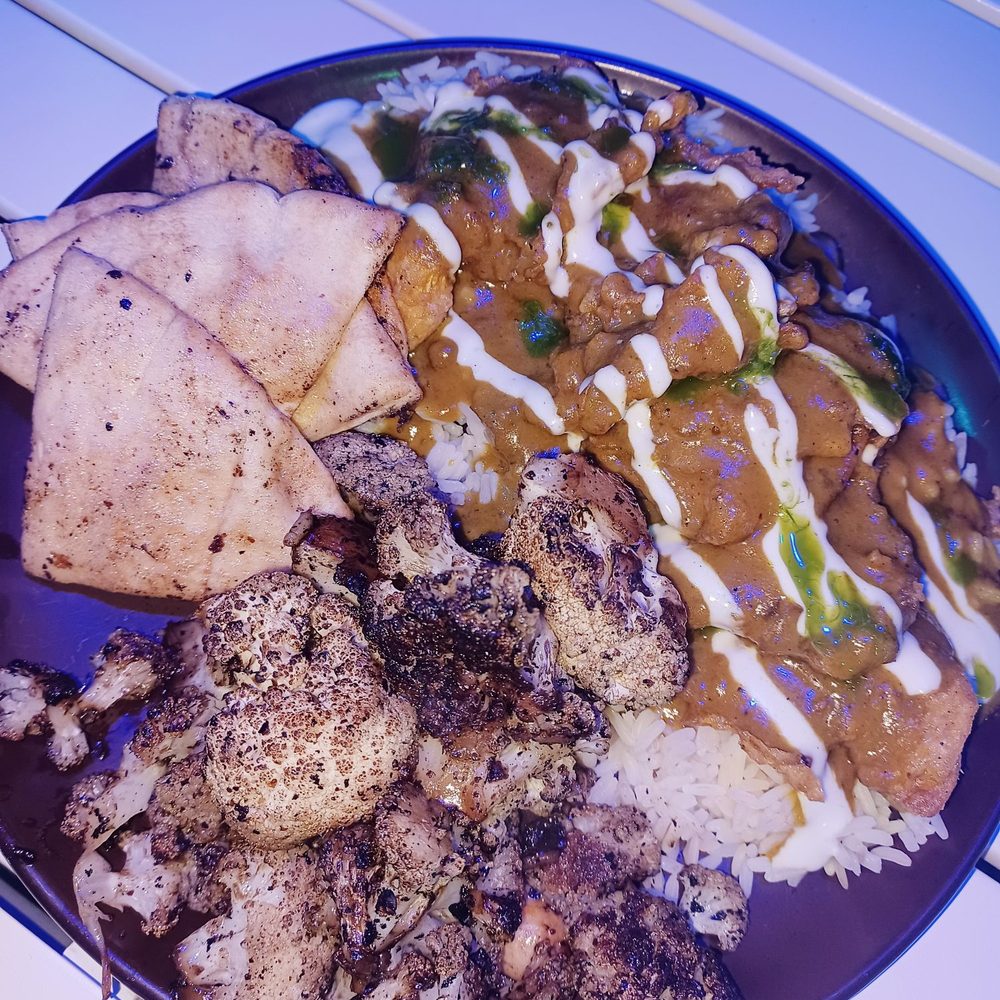 Crystals Soul Cafe - Curry oyster mushrooms, sautéed cauliflower, rice and Naan bread. - Soul Food Near Me - Los Angeles, California Crystals Soul Cafe - Curry oyster mushrooms, sautéed cauliflower, rice and Naan bread. - Soul Food Near Me - Los Angeles, California