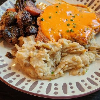 Spoke And Barrel - Chicken parmesean with pimento sauce smashed potatoes and brussel sprouts.  Amazing! - New American Near Me - Mandeville, Louisiana
