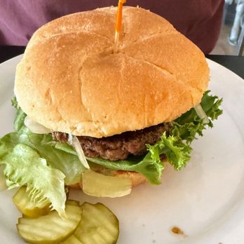 Errol Restaurant & Pub - 1/4# burger with lettuce and onions served on brioche bun and side of pickles - New American Near Me - Errol, New Hampshire Errol Restaurant & Pub - 1/4# burger with lettuce and onions served on brioche bun and side of pickles - New American Near Me - Errol, New Hampshire
