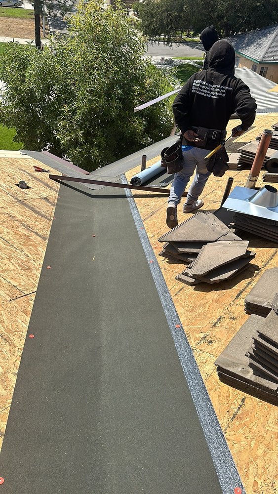 Slide of T’s Roofing 