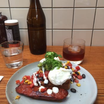 Seven Seeds - Cornbread with tomato and black bean salsa, avocado and poached eggs, with chorizo. - Coffee & Tea Near Me - Carlton, VIC Seven Seeds - Cornbread with tomato and black bean salsa, avocado and poached eggs, with chorizo. - Coffee & Tea Near Me - Carlton, VIC