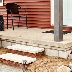 Pro-Active Masonry Solutions - Limestone steps built up on brick bases to match siding on home. Porch wall concrete block rebuild