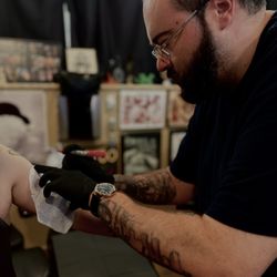 John Doe placing stencil