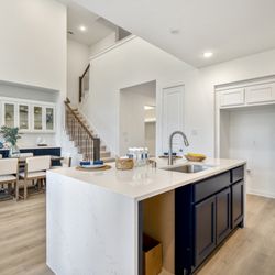 Staging the Nest - Vacant Staging - Home Builder Inventory Home - Kitchen and Dining with blue accents