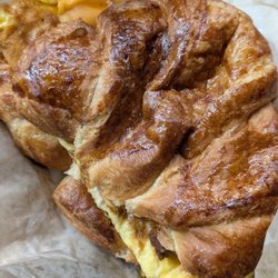 Cachito Coffee And Bakery - Breakfast sandwich. Sausage links, cheese and over cooked egg. Not good for the price of $12.