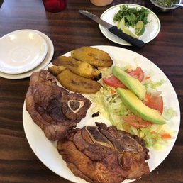 Fried pork chops, salad and maduros (sweet plantains) Fried pork chops, salad and maduros (sweet plantains)