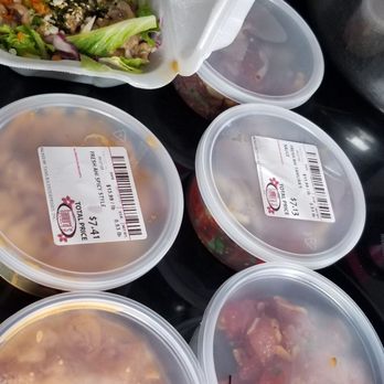 Off Da Hook - Poke taste testing.  Off Da Hook in Styrofoam container and da Hawaiian ahi in back - Food Trucks Near Me - Honolulu, Hawaii