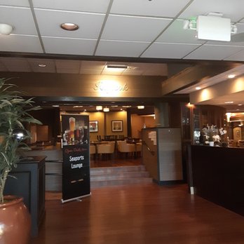 Seaports Restaurant - the lobby of a restaurant with a large plant in the foreground - Lounges Near Me - Seattle, Washington