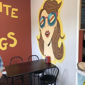 Dynamite Dawgs - a woman with sunglasses painted on the wall - Hot Dogs Near Me - Mentor, Ohio