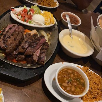 Uncle Julio's - Steak fajitas for two, charro beans, rice, white queso, chips, and salsa - Tex-Mex Near Me - Oklahoma City, Oklahoma Uncle Julio's - Steak fajitas for two, charro beans, rice, white queso, chips, and salsa - Tex-Mex Near Me - Oklahoma City, Oklahoma