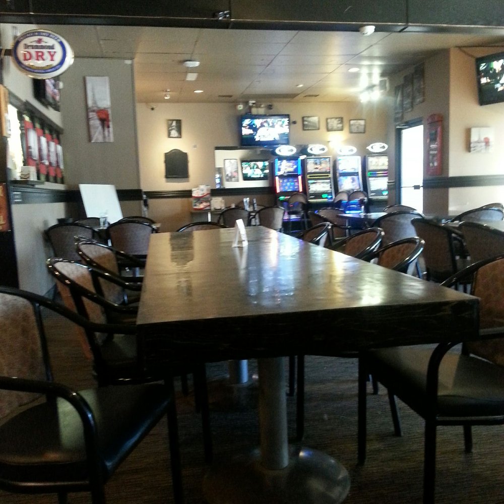 Chelsea's Pub - tables and chairs in a restaurant - Pubs Near Me - Bon Accord, Alberta