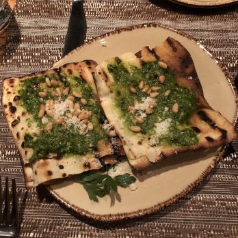 Giulia - sardinian flatbread with ramp pesto, pine nuts, and parmigiano - $6 - Italian Near Me - Cambridge, Massachusetts