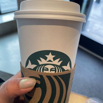Starbucks - a hand holding a starbucks cup - Coffee & Tea Near Me - San Francisco, California Starbucks - a hand holding a starbucks cup - Coffee & Tea Near Me - San Francisco, California