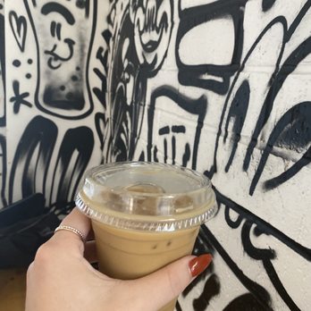 Spokesman - Iced Vanilla Latte (12oz- $5.55 +$1tip) Featuring wall art - Coffee & Tea Near Me - Austin, Texas