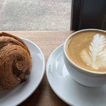 Crema Coffee Roasters - Croissant with cappuccino - Coffee & Tea Near Me - Nashville, Tennessee Crema Coffee Roasters - Croissant with cappuccino - Coffee & Tea Near Me - Nashville, Tennessee
