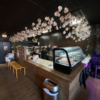 First Sip Cafe - a coffee shop with a counter and a display of pastries - Coffee & Tea Near Me - Chicago, Illinois