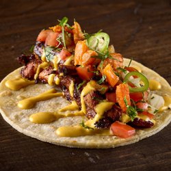 Taco Bamba Landmark - Taco with grilled jerk chicken, Jamaican aioli, pineapple pico de gallo, sweet potato, serranos