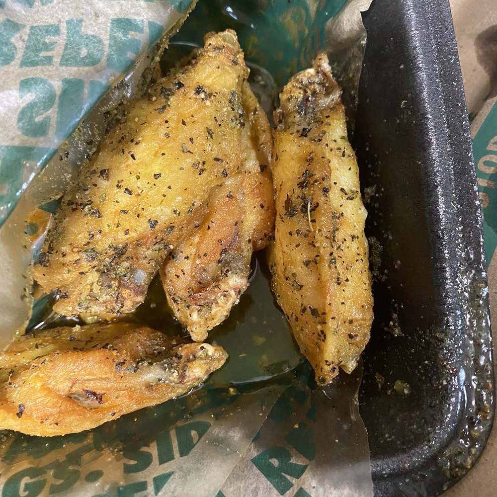 Wingstop - a tray of fried fish with a side of fries - Chicken Wings Near Me - Woodstock, Georgia