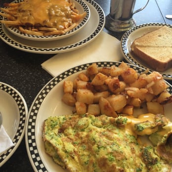 57s All American Grill - Broccoli omelet with potatoes on the side, chili cheese fries, and some toast (came with the omelet). - American Near Me - Flushing, New York 57s All American Grill - Broccoli omelet with potatoes on the side, chili cheese fries, and some toast (came with the omelet). - American Near Me - Flushing, New York