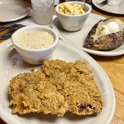 Texas Roadhouse - Early Dine $11.99, Country Fried Sirloin w/ white cream gravy on the side. Baked Potato side & Macaroni and Cheese side(.99 extra).