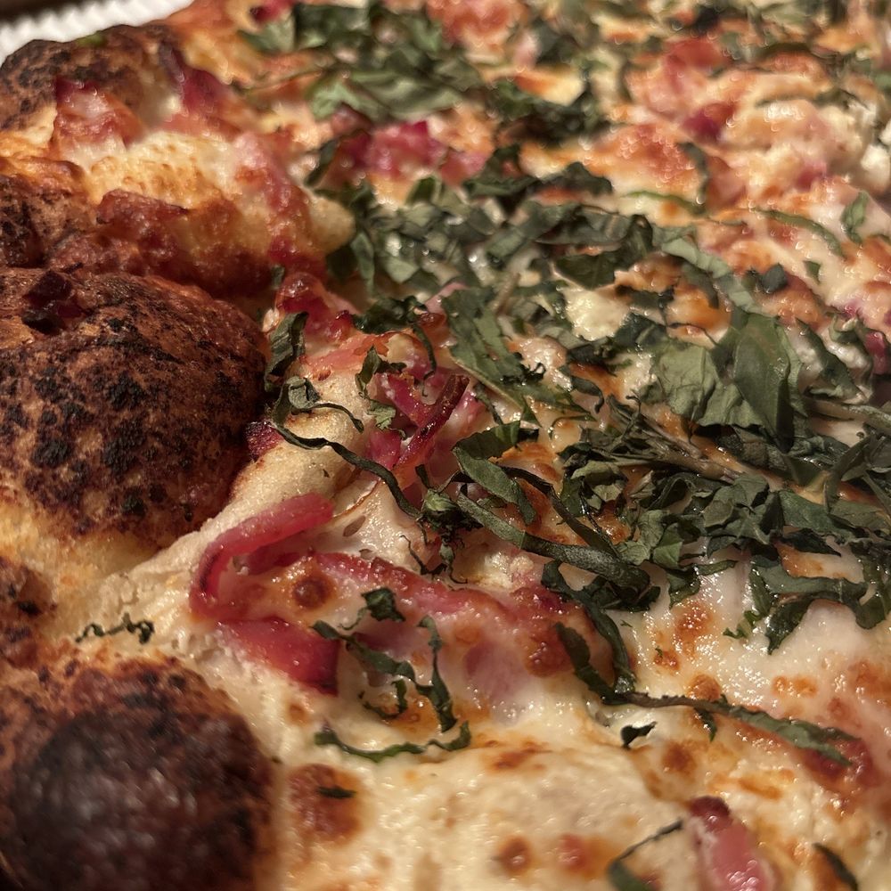 Close up of the best pizza ever, the "Tribeca" pizza on the specialty menu. Close up of the best pizza ever, the "Tribeca" pizza on the specialty menu.