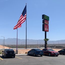 the american flag flying over the parking lot the american flag flying over the parking lot