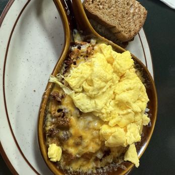 Egg Works - Bacon & Onion Skillet Breakfast with scrambled eggs and wheat toast - Breakfast & Brunch Near Me - Las Vegas, Nevada Egg Works - Bacon & Onion Skillet Breakfast with scrambled eggs and wheat toast - Breakfast & Brunch Near Me - Las Vegas, Nevada
