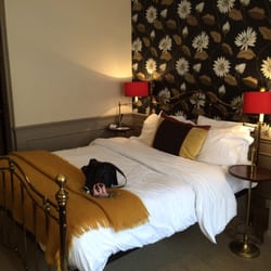 The Feathers - Lovely bed with mohair throw.