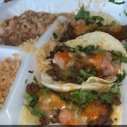 a plate of tacos and rice a plate of tacos and rice