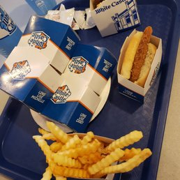 a tray of food including a hot dog and french fries