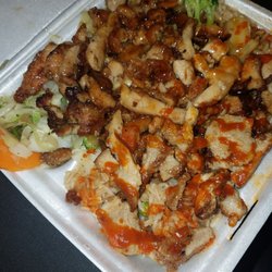 Sarku Japan - Chicken Teriyaki with white rice and sriracha drizzled on top. Yum!